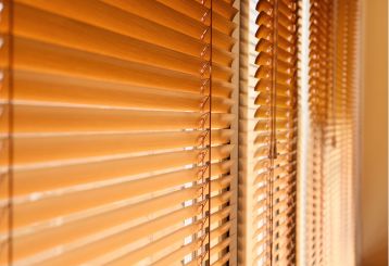 Mini blinds installed on windows, enhancing interior decor with a modern touch.