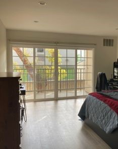 Side-by-side of San Francisco bedroom balcony glass door before custom window shades installation.